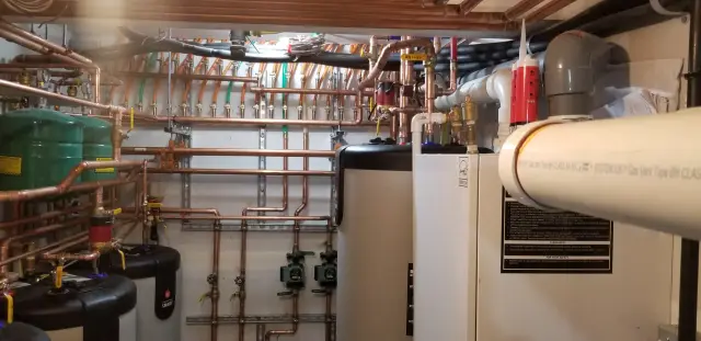 Copper pipes for heating system, organized with valves and fittings