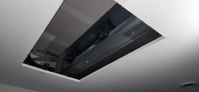 Outdoor Gree heat pump, newly installed. The heat pump is black and has a brand logo visible on