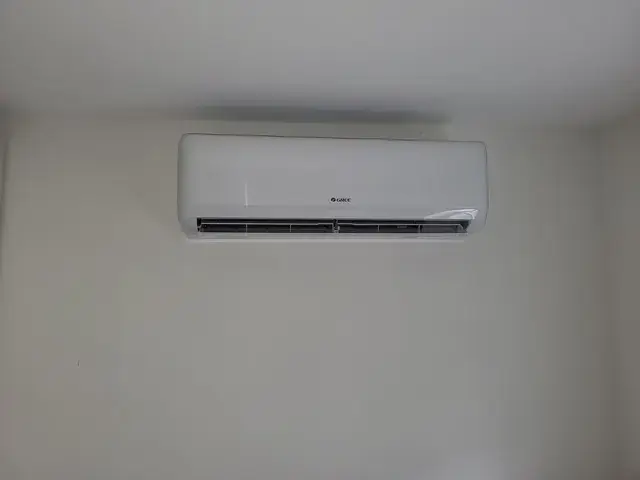 Air conditioning unit installed on a white wall