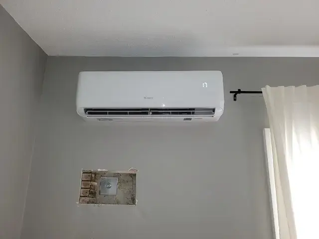 Air conditioning unit installed on a wall
