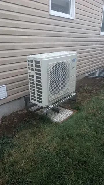 Outdoor Gree heat pump installed outside house