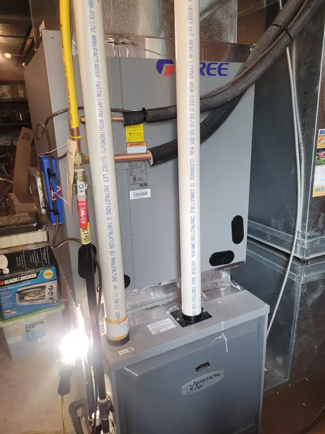 Outdoor heat pump installation with Gree branding visible