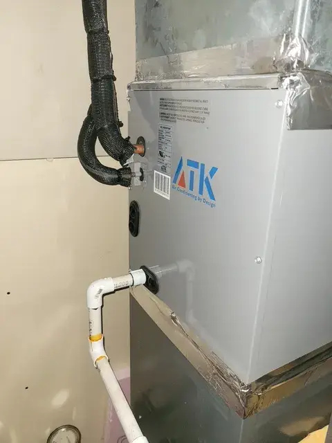 Outdoor Gree heat pump installed on concrete pad