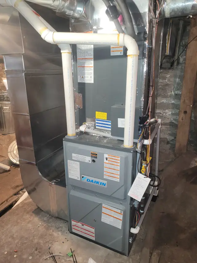 Outdoor Gree heat pump installed in a residential setting