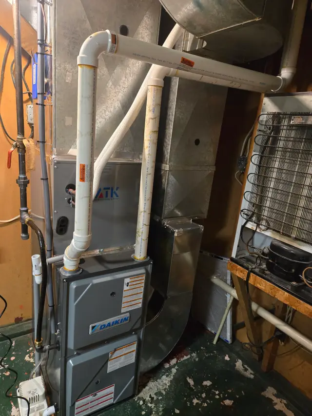 HVAC unit with visible piping and labels