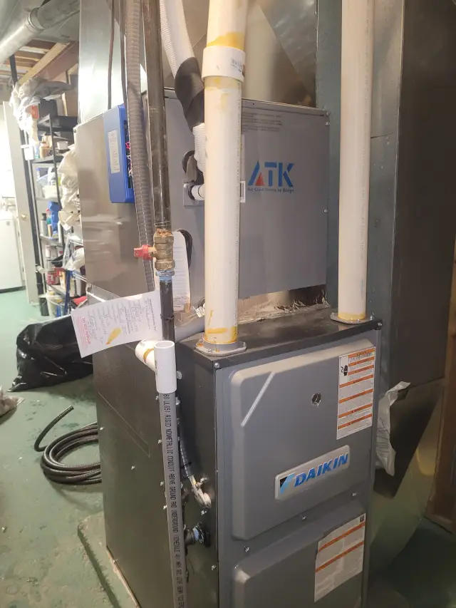 A Daikin furnace, a popular brand known for its heating and cooling systems, is installed in a home.