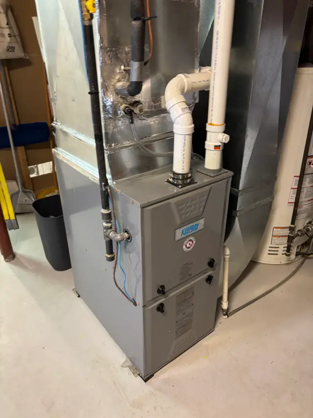 Outdoor Gree heat pump installed on concrete slab