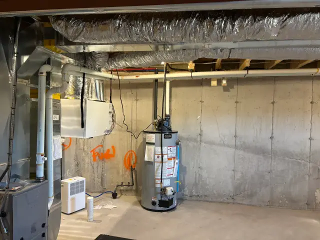 ductwork with insulation above concrete floor