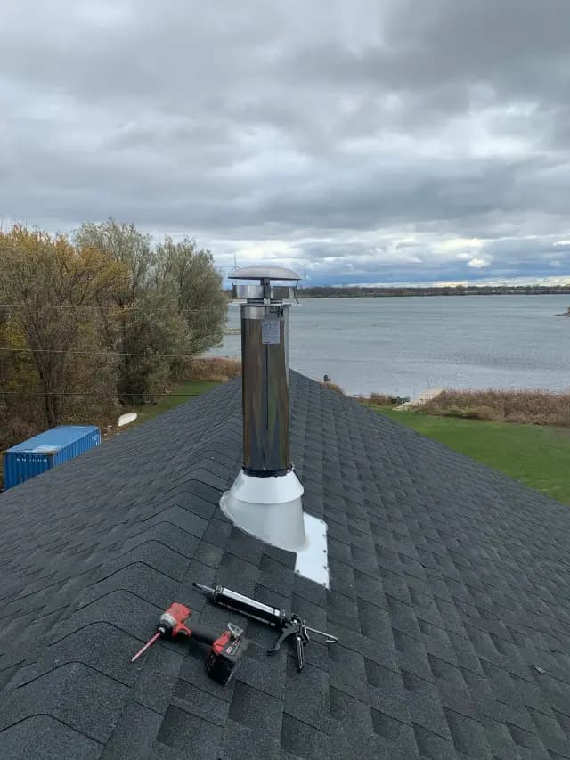 Outdoor Gree heat pump with a sleek design and silver color, installed on a roof with a view