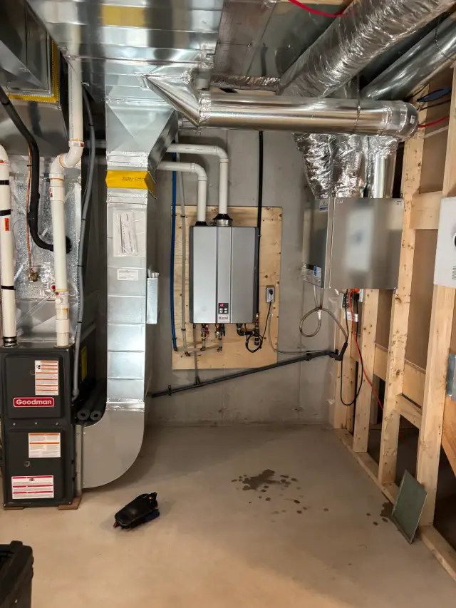 Outdoor Gree heat pump installed on concrete slab with wooden framing