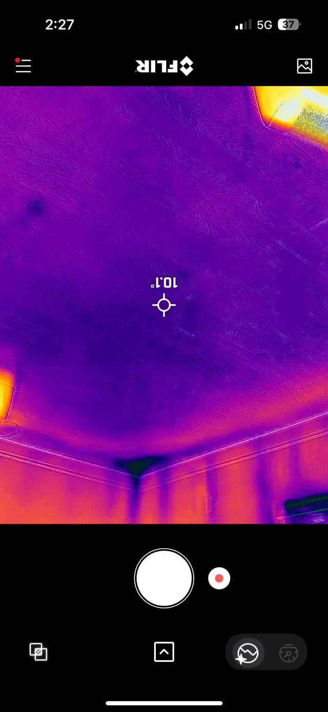 Outdoor Gree heat pump, newly installed. The pump is placed on a concrete surface with a metal frame